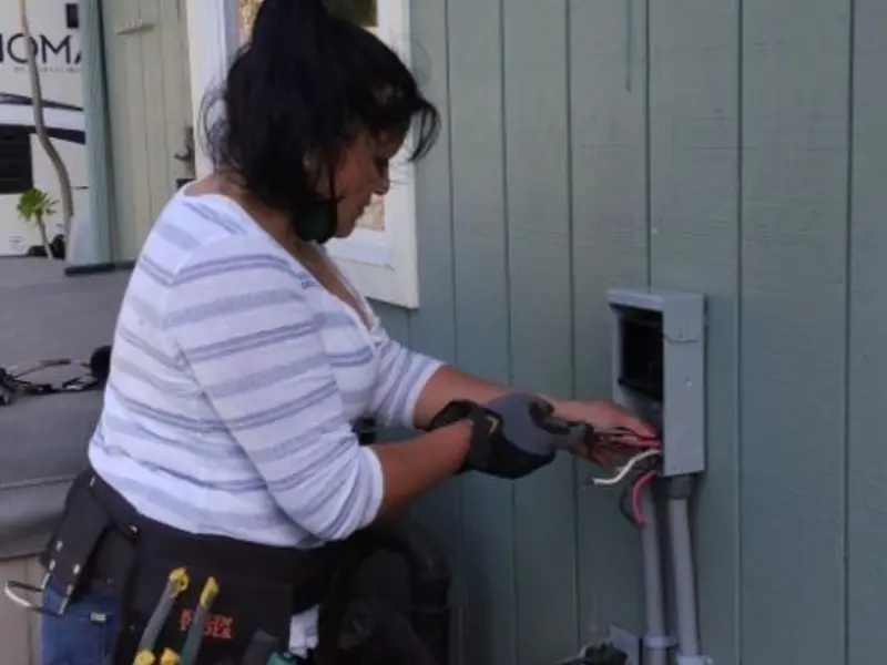 Licensed electrician wiring an exterior subpanel in Calistoga